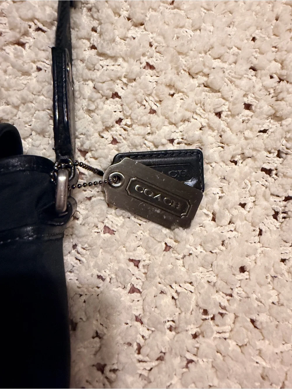 Coach sleek black